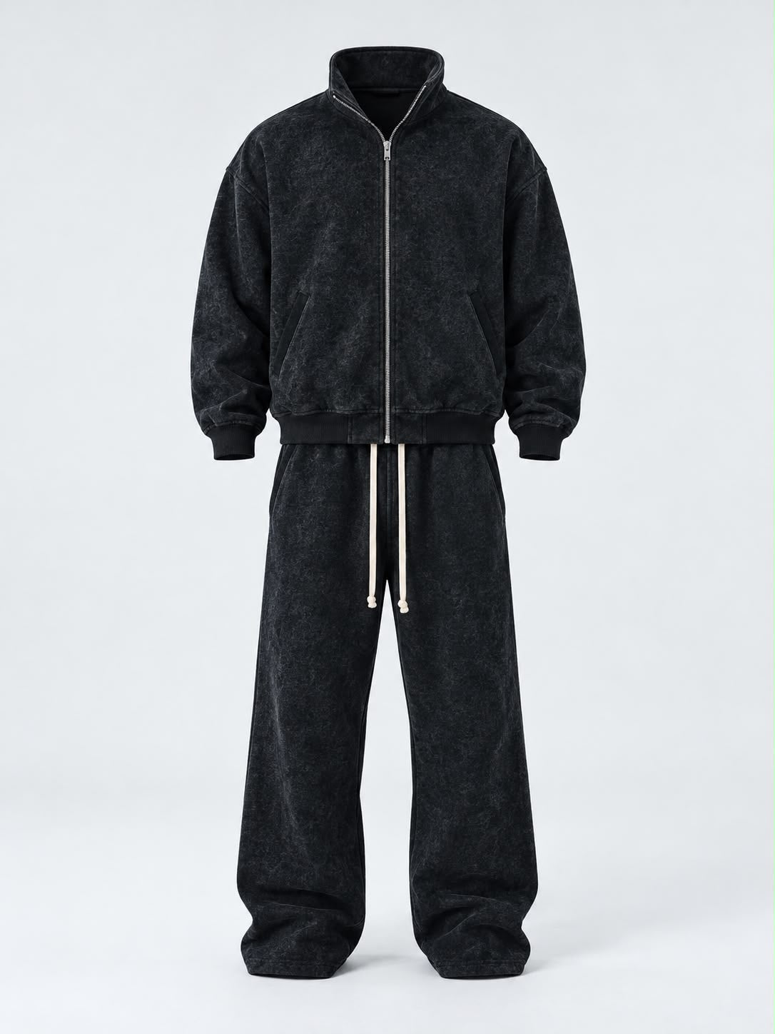 Completo Duca da uomo nero in tessuto effetto slavato, con giacca a zip e pantaloni ampi con coulisse bianca.