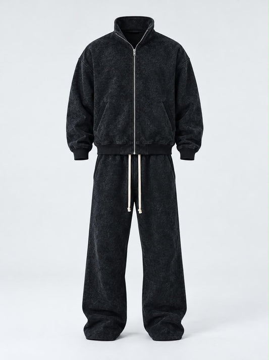 Completo Duca da uomo nero in tessuto effetto slavato, con giacca a zip e pantaloni ampi con coulisse bianca.