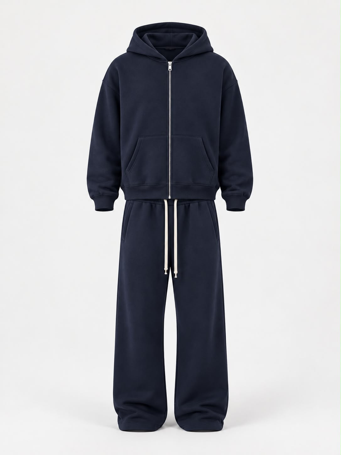Tuta Felpata con zip blu navy, in morbido tessuto felpato, con cappuccio, tasche a marsupio e pantaloni con coulisse.